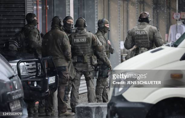 Special forces of the German police stand in the center of the city of Dresden, eastern Germany, on December 10 as a large-scale police operation has...