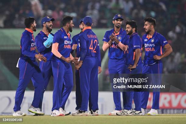 India's cricketers celebrate after the dismissal of Bangladesh's Yasir Ali during the third and final one-day international cricket match between...