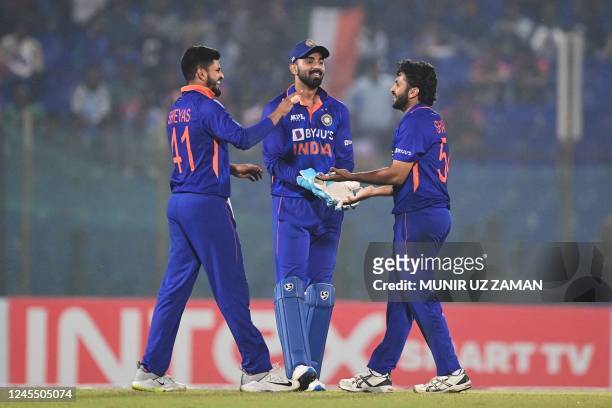India's Shardul Thakur celebrates with teammates after the dismissal of Bangladesh's Mehidy Hasan Miraz during the third and final one-day...