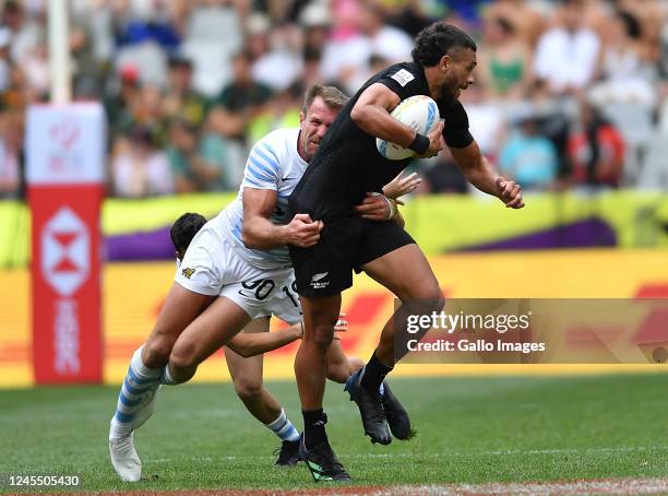 Brady Rush of New Zealand and Fernando Luna of Argentina during the match between New Zealand and Argentina on day 2 of the HSBC Cape Town Sevens at...