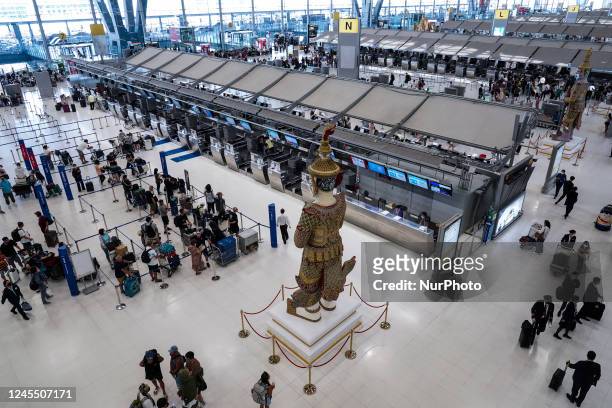Travelers wait to check in for flights at the Suvarnabhumi International Airport in Samut Prakan province, Thailand, 10 December, 2022. Thailand...