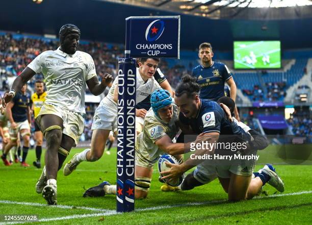 Le Harve , France - 10 December 2022; James Lowe of Leinster is tackled into touch by Maxime Baudonne of Racing 92 during the Heineken Champions Cup...