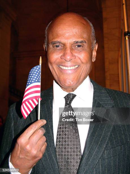 Harry Belafonte waves American flag on Dec. 5 at AARP The Magazine Impact Awards at the New York Public Library in New York, NY. He was one of the...
