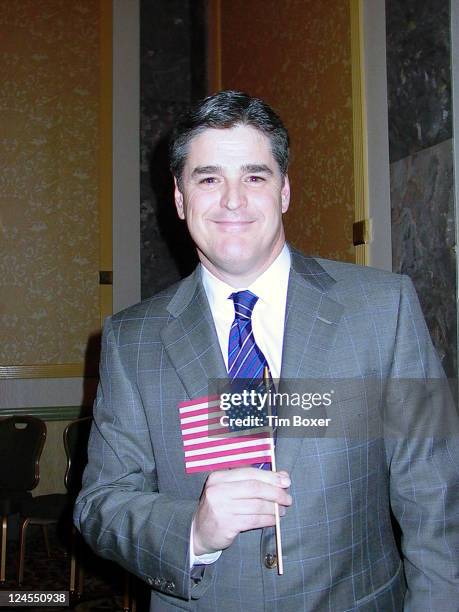 Sean Hannity waves American flag at 20th anniversary dinner of Congress of Racial Equality on January 17 at the New York Hilton Hotel, New York, NY....