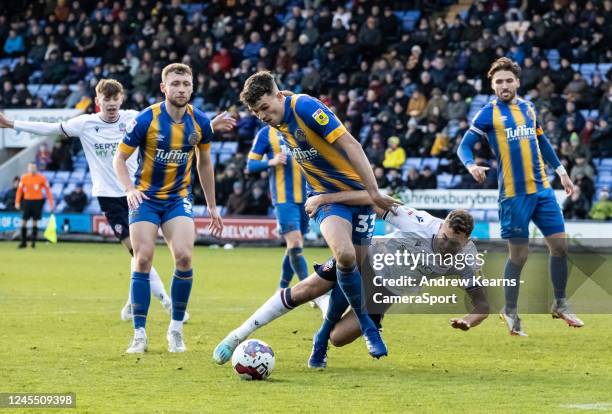 Bolton Wanderers' Dion Charles goes down in the penalty area from a challenge by Shrewsbury Town's Tom Flanagan during the Sky Bet League One between...