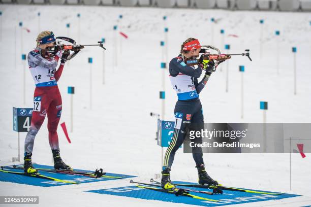 Lisa Theresa Hauser of Austria, Denise Herrmann-Wick of Germany at the shooting range during the Women 10 km Pursuit at the BMW IBU World Cup...