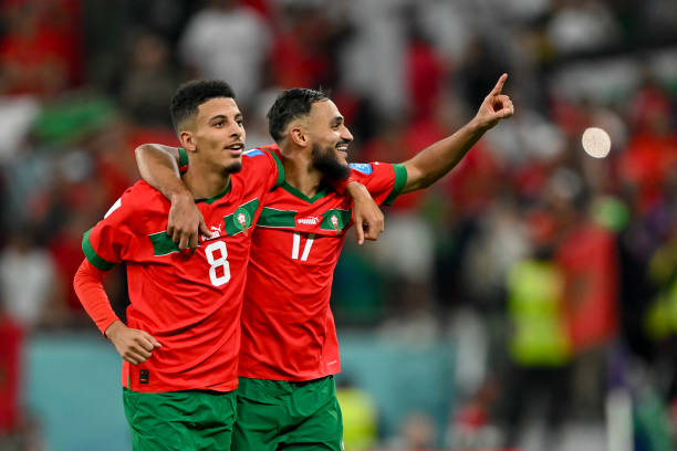 Azzedine Ounahi of Morocco and Sofiane Boufal of Morocco celebrate after winning the FIFA World Cup Qatar 2022 quarter final match between Morocco...