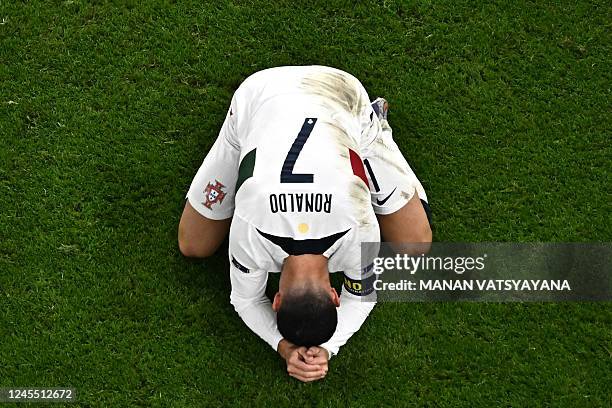 Portugal's forward Cristiano Ronaldo reacts during the Qatar 2022 World Cup quarter-final football match between Morocco and Portugal at the...