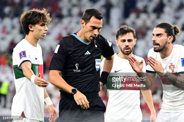 Players of Portugal Joao Felix, Ruben Neves and Bernardo Silva argues with the referee Facundo Tello during the FIFA World Cup Qatar 2022 quarter...