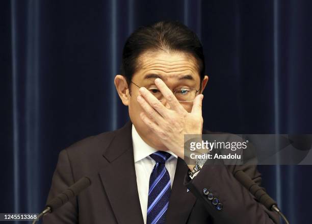 Japanese Prime Minister Fumio Kishida adjusts his glasses as he speaks before press conference at his official residence in Tokyo, Japan on December...