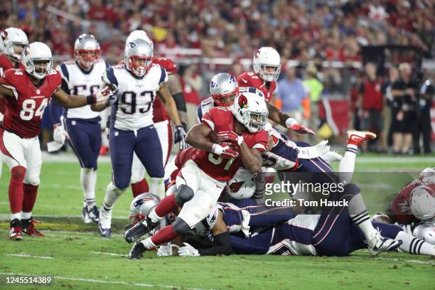 Arizona Cardinals running back David Johnson runs with the ball during an NFL football game between the New England Patriots and the Arizona...
