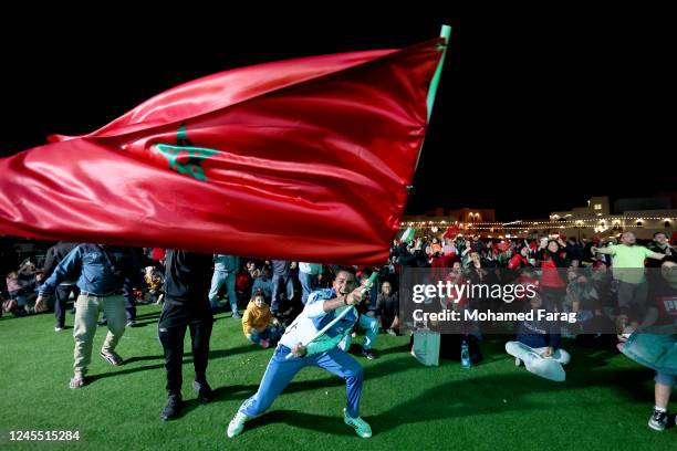 Morocco fan watch the Quarter final match between Morocco and Portugal during the FIFA World Cup Qatar 2022 at old port on December 10, 2022 in Doha,...