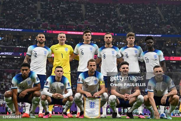 England's defender Kyle Walker, England's goalkeeper Jordan Pickford, England's defender Harry Maguire, England's midfielder Jordan Henderson,...