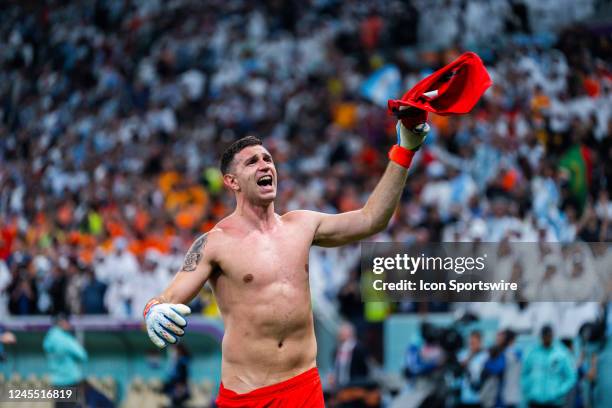 Argentina goalkeeper Emiliano Martinez celebrates Argentinas win in the Quarterfinal match of the 2022 FIFA World Cup in Qatar between Argentina and...