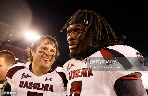 Stephen Garcia and Jadeveon Clowney of the South Carolina Gamecocks celebrate after their 45-42 win over the Georgia Bulldogs at Sanford Stadium on...