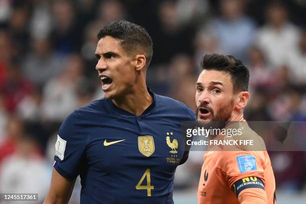 France's defender Raphael Varane reacts next to France's goalkeeper Hugo Lloris during the Qatar 2022 World Cup quarter-final football match between...