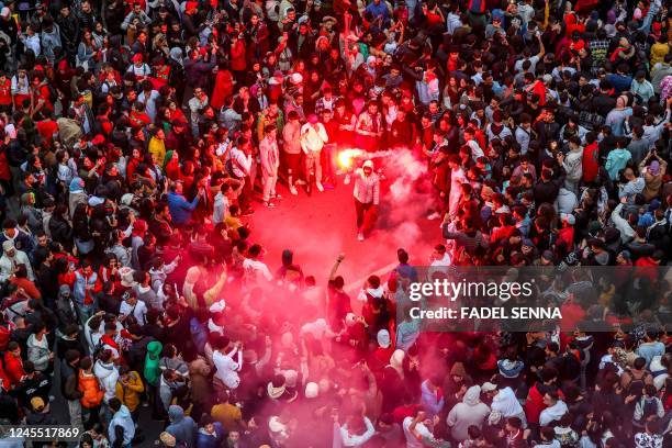 Morocco's supporters celebrate after their country's win of the Qatar 2022 World Cup football match between Morocco and Portugal, in the capital...
