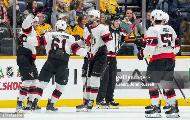 Claude Giroux and Derick Brassard of the Ottawa Senators celebrates a goal against the Nashville Predators during an NHL game at Bridgestone Arena on...