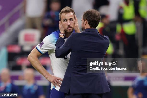Harry Kane of England, Coach Gareth Southgate of England disappointed after being knocked out during the World Cup match between England v France at...
