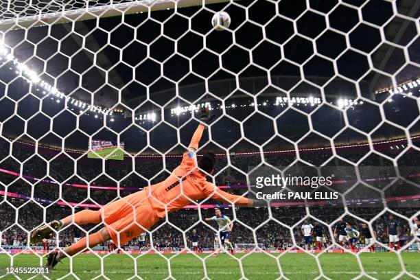 England's forward Harry Kane takes a penalty kick and misses during the Qatar 2022 World Cup quarter-final football match between England and France...