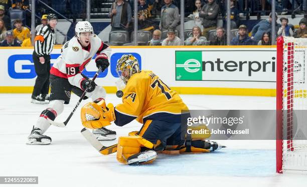 Drake Batherson of the Ottawa Senators scores a goal against Juuse Saros of the Nashville Predators during an NHL game at Bridgestone Arena on...
