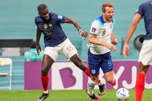 England player Harry Kane and France player Dayot Upamecano during the FIFA World Cup 2022, Quarterfinal match between France and England at Al Bayt...