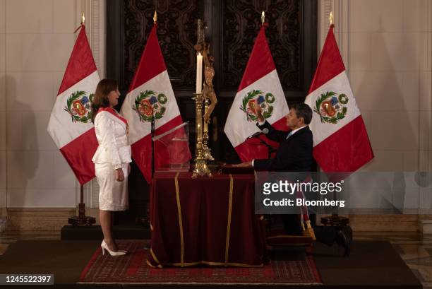 Dina Boluarte, Peru's president, left, and Cesar Augusto Cervantes Cardenas, Peru's new interior minister, attend a cabinet swearing in ceremony at...