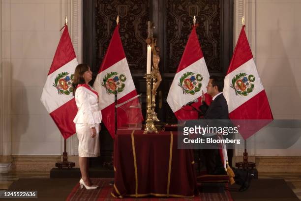 Dina Boluarte, Peru's president, left, and Jose Andres Tello Alfaro, Peru's new justice minister, attend a cabinet swearing in ceremony at the...