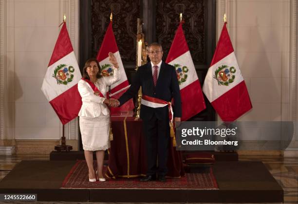 Dina Boluarte, Peru's president, left, shakes hands with Pedro Angulo Arana, Peru's new prime minister, during a cabinet swearing in ceremony at the...