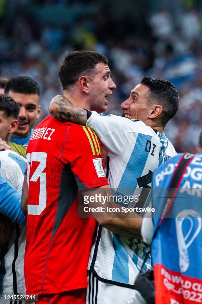 Argentina goalkeeper Emiliano Martinez and forward Angel Di Maria celebrate Argentinas win in the Quarterfinal match of the 2022 FIFA World Cup in...