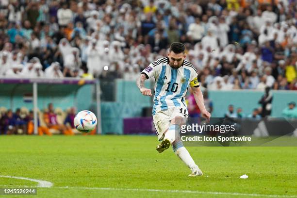 Lionel Messi of Argentina shots the ball during the FIFA World Cup Qatar 2022 quarter final match between Netherlands and Argentina on December 09 at...