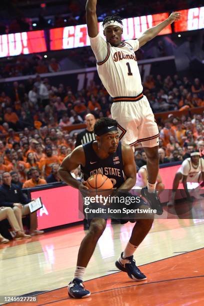 Jalen Pickett guard Penn State University Nittany Lions gets defender Sencire Harris guard University of Illinois Fighting Illini to leave his feet...