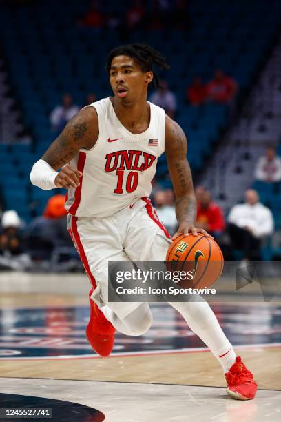 Keshon Gilbert of the UNLV Rebels dribbles the ball during The Clash presented by the Halal Guys basketball tournament featuring the Washington State...