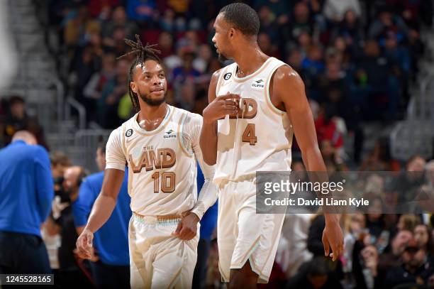 Darius Garland and Evan Mobley of the Cleveland Cavaliers talk on the court during the game against the Oklahoma City Thunder on December 10, 2022 at...