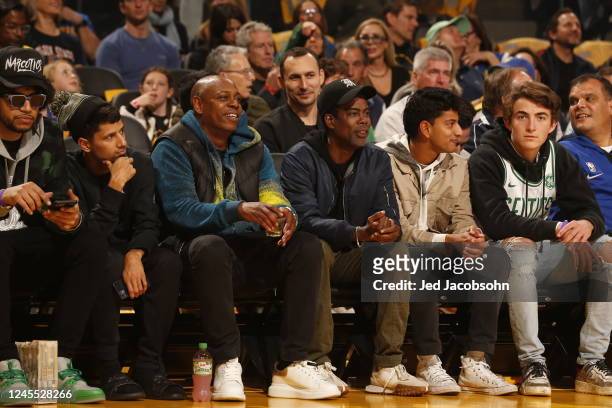 Dave Chappelle and Chris Rock look on during the game between the Boston Celtics and the Golden State Warriors on December 10, 2022 at Chase Center...