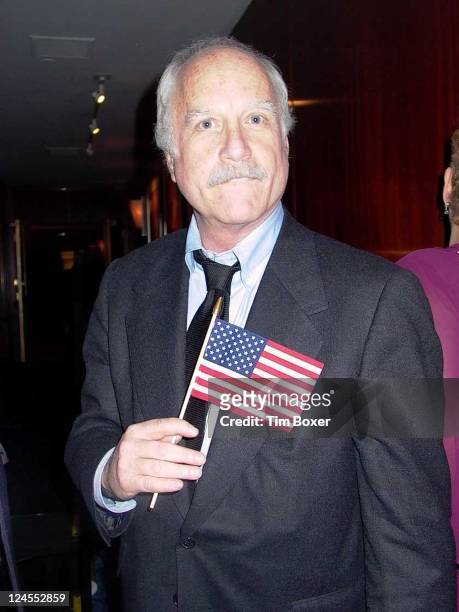 Actor Richard Dreyfuss waves American flag in remembrance of the September 11 terrorist attack on World Trade Center, at Jewish National Fund dinner...