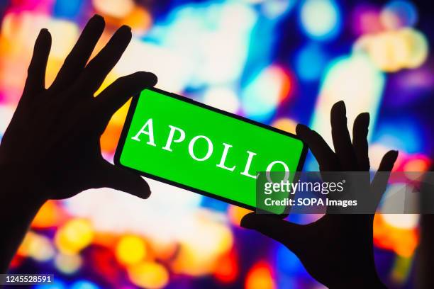 In this photo illustration, the Apollo Global Management logo is displayed on a smartphone screen.