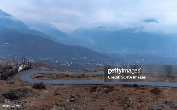 View of mountains covered with clouds during a cold evening after a rainfall in the outskirts of Srinagar.