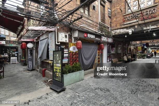 Shuttered shop at Tianzifang, a once-popular food and beverage area that saw wall-to-wall crowds, in Shanghai, China, on Saturday, Dec. 11, 2022....