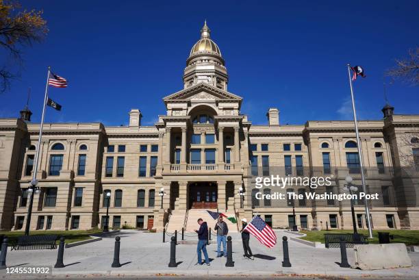 Veterans Matt Zeller and James Powers, and Zabih Rauf promote the Afghan Adjustment Act on October 21, 2022 in front of the state capitol in...