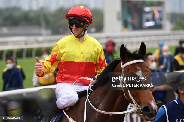 Australian jockey Zac Purton riding California Spangle, trained by Tony Cruz, celebrates winning the Hong Kong Mile G1 race during the Hong Kong...