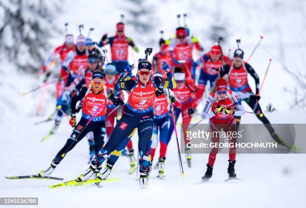 Biathletes compete during the women's 4x6 relay competition of the IBU Biathlon World Cup in Hochfilzen, Austria on December 11, 2022. - Austria OUT...