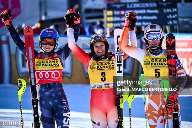 Second-placed USA's Mikaela Shiffrin, winner Switzerland's Wendy Holdener and third-placed Slovakia's Petra Vlhova celebrate after the Women's Slalom...