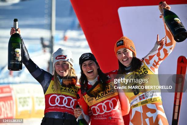 Second-placed USA's Mikaela Shiffrin, winner Switzerland's Wendy Holdener and third-placed Slovakia's Petra Vlhova celebrate on the podium after the...