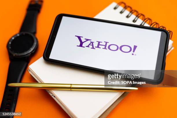 In this photo illustration a Yahoo logo seen displayed on a smartphone.