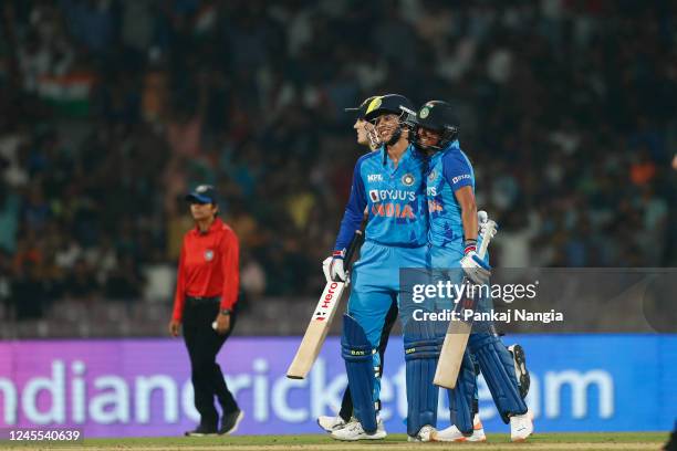 Smriti Mandhana of India celebrates after scoring a fifty during the T20 International series between India and Australia at Dr DY Patil Cricket...