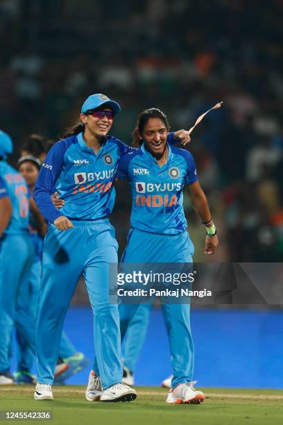 Smriti Mandhana and Harmanpreet Kaur of India celebrate the victory during the T20 International series between India and Australia at Dr DY Patil...