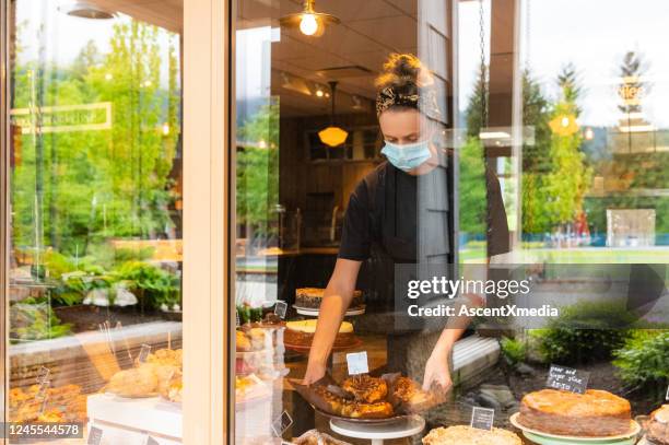 baker opening shop after the coronavirus lockdown - reopening stock pictures, royalty-free photos & images