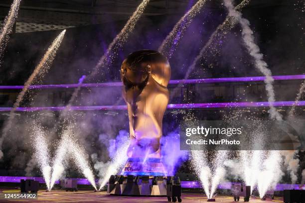 Fire works around large-scale FIFA World Cup trophy before the FIFA World Cup Qatar 2022 quarter final match between Morocco and Portugal at Al...