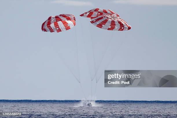 S Orion Capsule splashes down after a successful uncrewed Artemis I Moon Mission on December 11, 2022 seen from aboard the U.S.S. Portland in the...